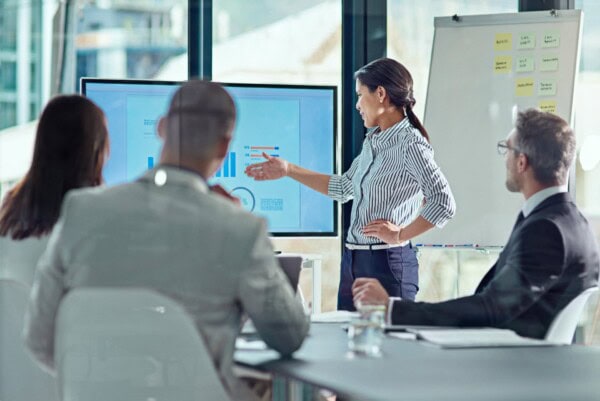 beginning her presentation with a bang. a businesswoman delivering a presentation in the boardroom.